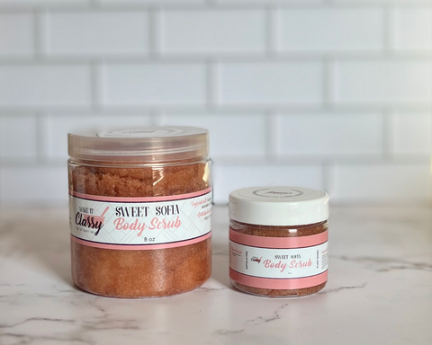 Two jars of body scrub on a marble surface with a tiled wall background