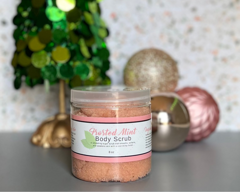 Jar of body scrub with festive decorations in the background